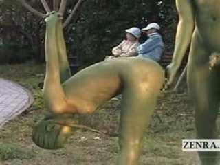 Subtitled jepang woman painted to mimic park statue